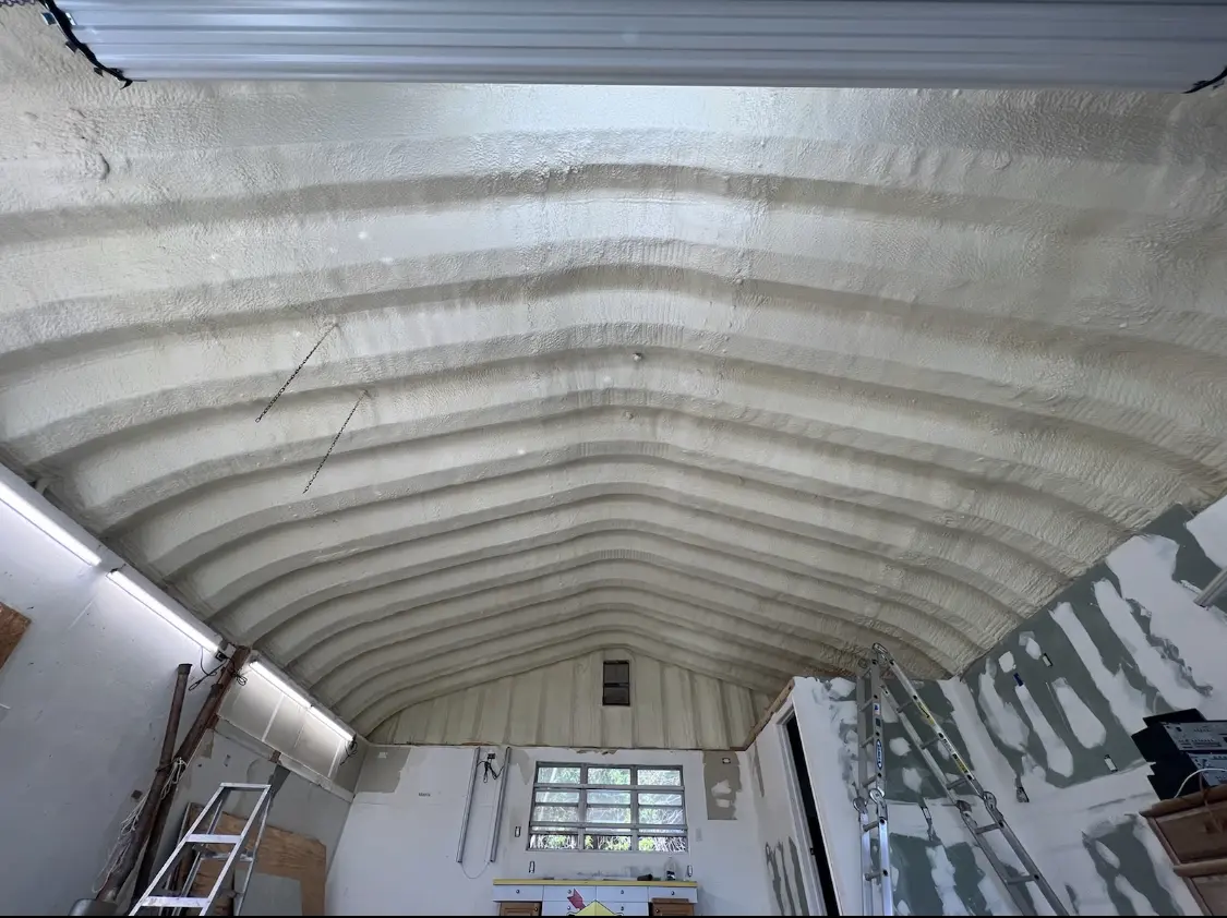 Spray polyurethane foam applied to the underside of a metal roof deck in Bryant